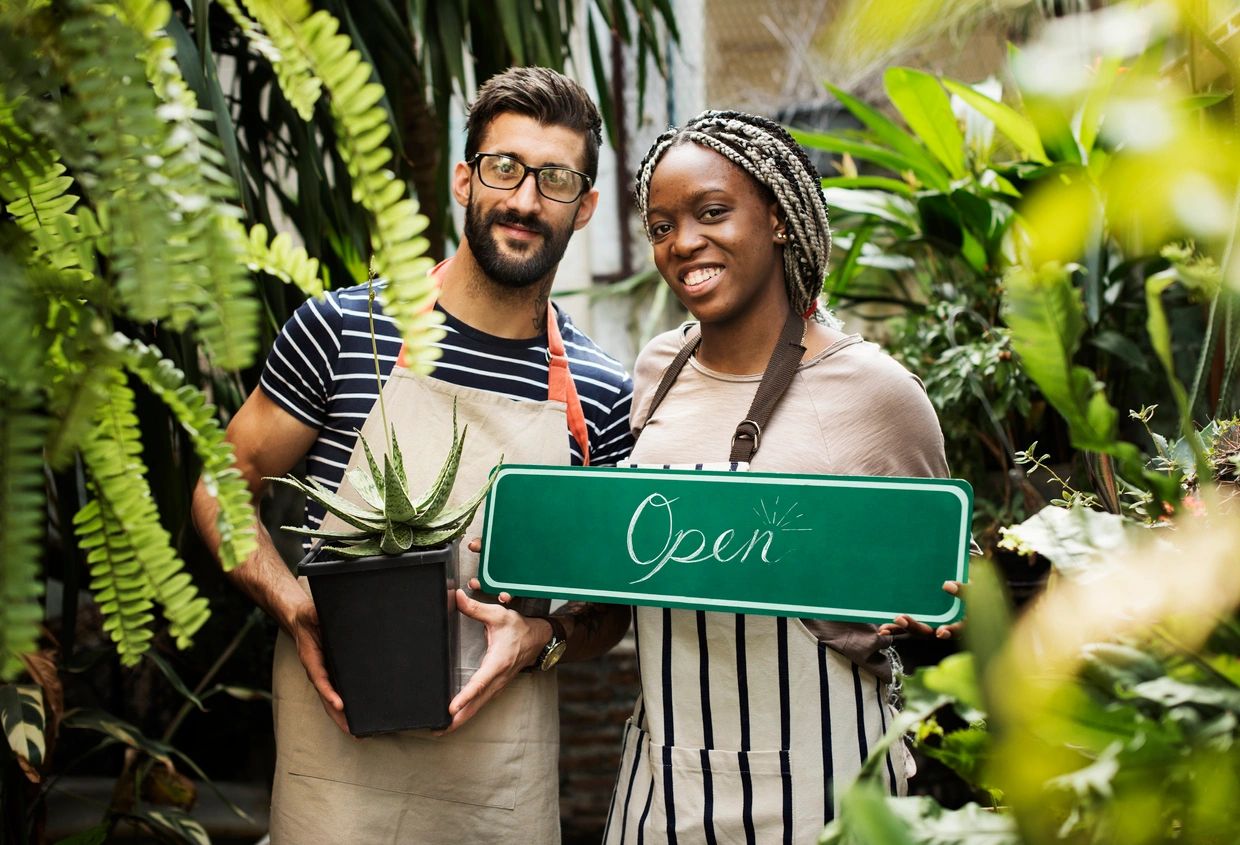Partners opening a small business floral or plant store.
